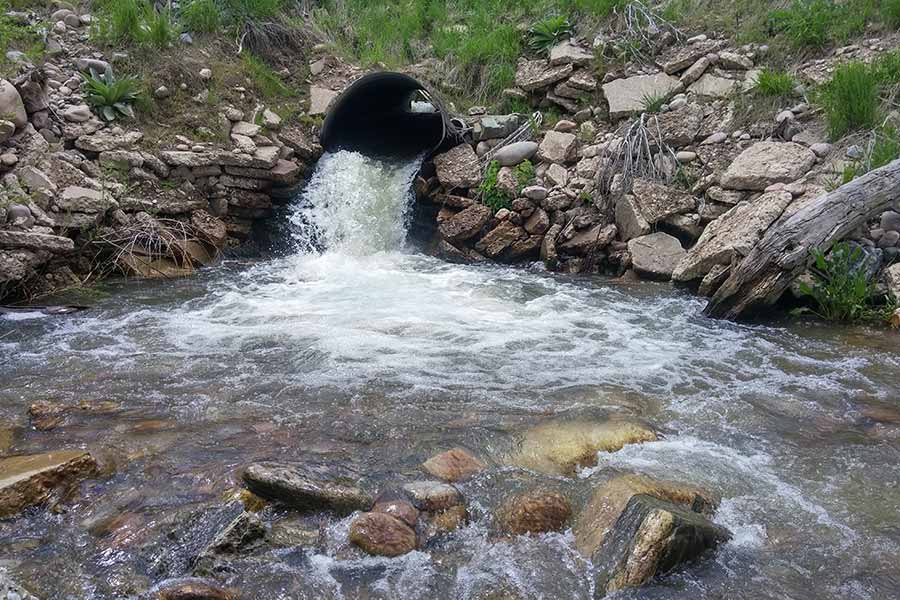 A culvert, with water running through it, at Dalton Creek in Morgan County